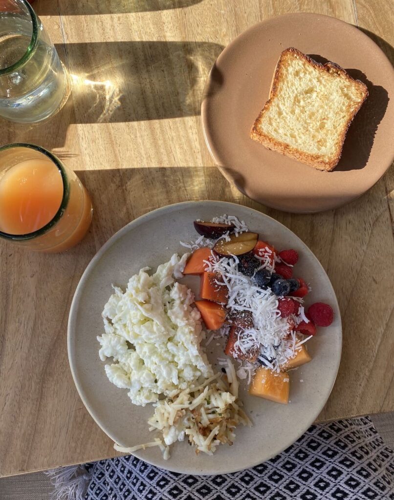 Gluten-free breakfast meal of gluten-free toast, egg whites, and fresh fruit to eat when you have celiac disease.