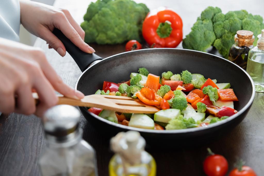 Cooking vegetables in a pan for a healthy anti-inflammatory diet.
